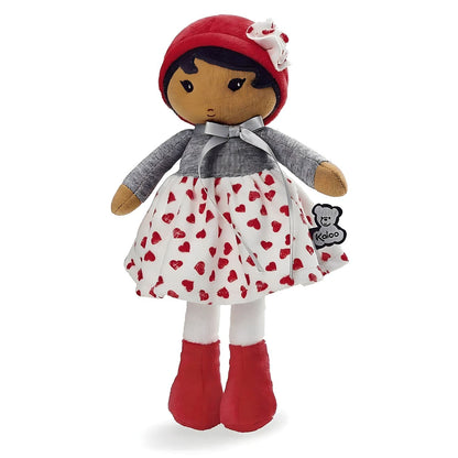 Muñeca de Trapo Jade de Kaloo con vestido blanco de corazones rojos, jersey gris y gorro rojo