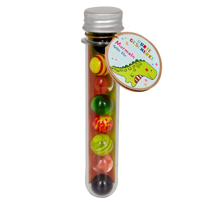 Conjunto de canicas Dinosaurio Verde de Spiegelburg en tubo con canicas coloridas