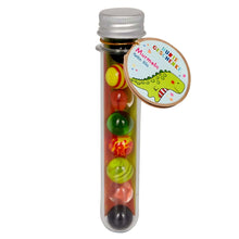 Conjunto de berlindes Dinossauro Verde da Spiegelburg em tubo com berlindes coloridos