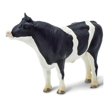 Touro Holstein-malhado de brinquedo em figura de borracha