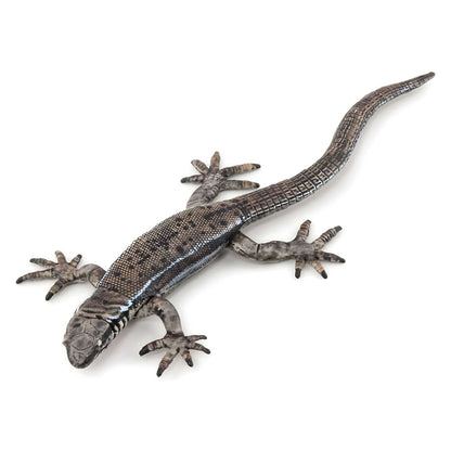 Figura de caucho lagarto común en vista lateral