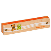 Criança a tocar harmónica infantil colorida 7 Amigos da Spiegelburg