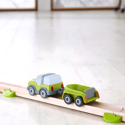 Vehículo de juguete con remolque para niños a los que les gusta la acción