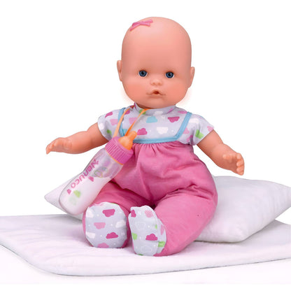 Boneco Nenuco de babygrow rosa sentado com biberão mágico