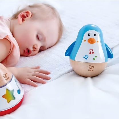 Juguete musical Hape en forma de pingüino oscilante