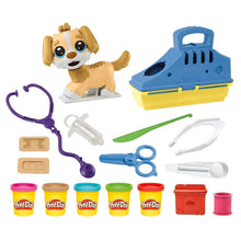 Criança a brincar com o Play Doh Kit veterinário e cachorrinho de massa colorida