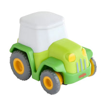 Trator de Fricção Verde em fotografia de produto